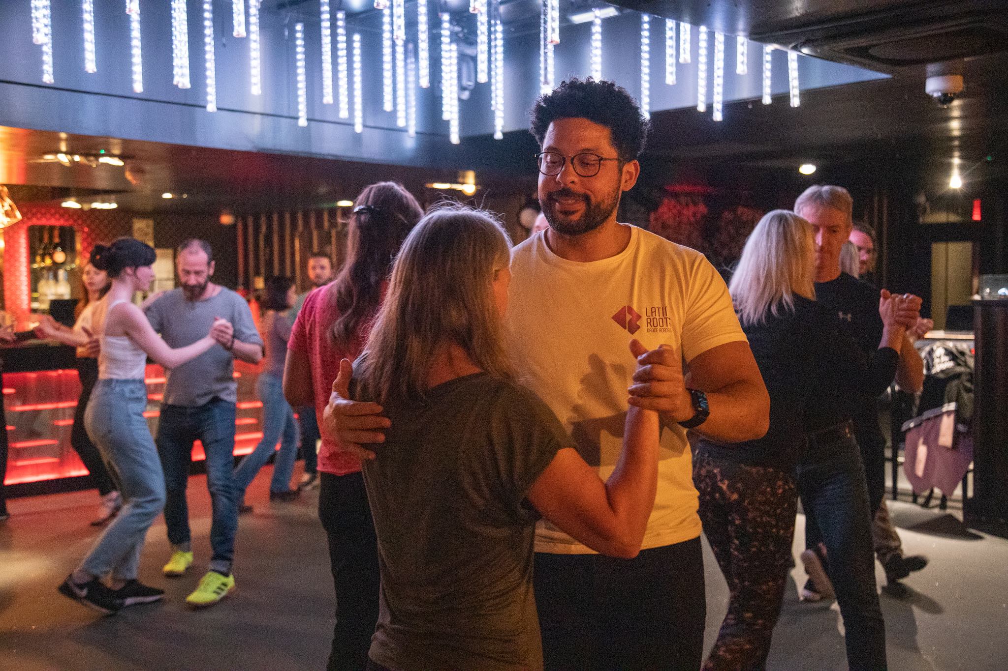 Latin Roots instructors helping students learn Salsa and Bachata in Edinburgh