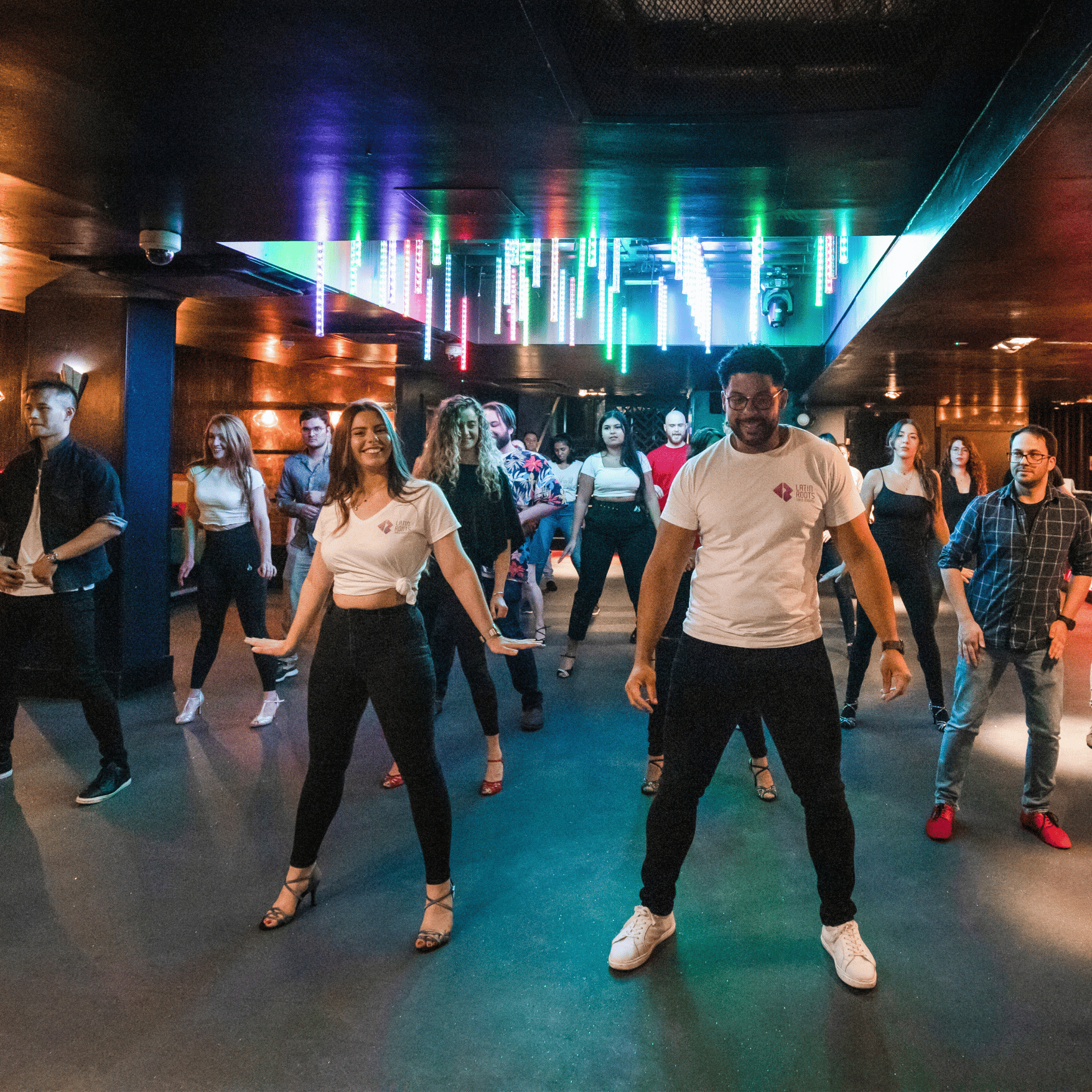 Experienced dancers training Salsa and Bachata in a regular Latin Roots class